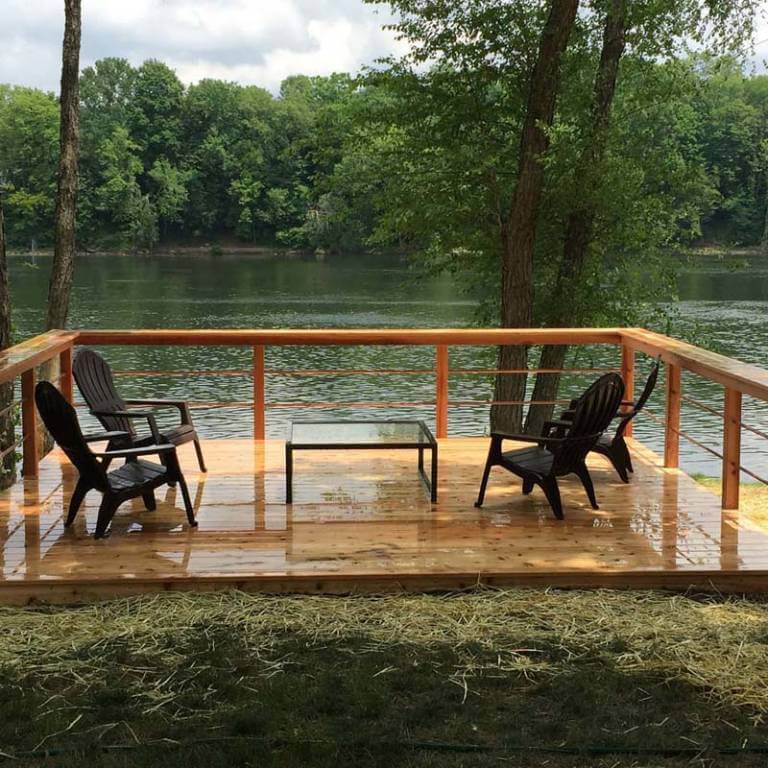 Wooden deck with lake in background