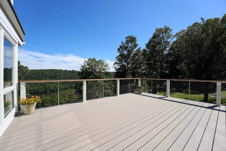 Wooden deck with woods in background