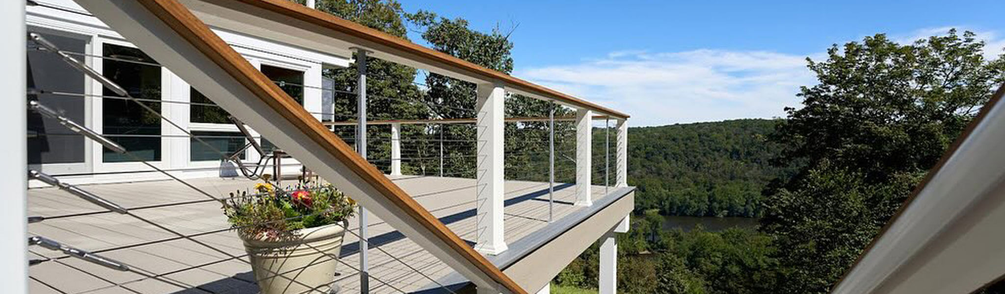 Exterior view of balcony with woods in the background